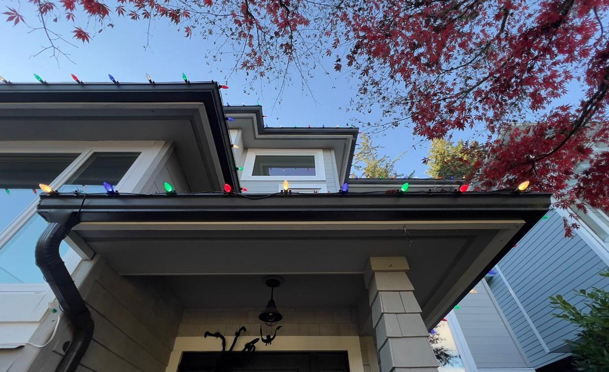 White and red christmas lights on house